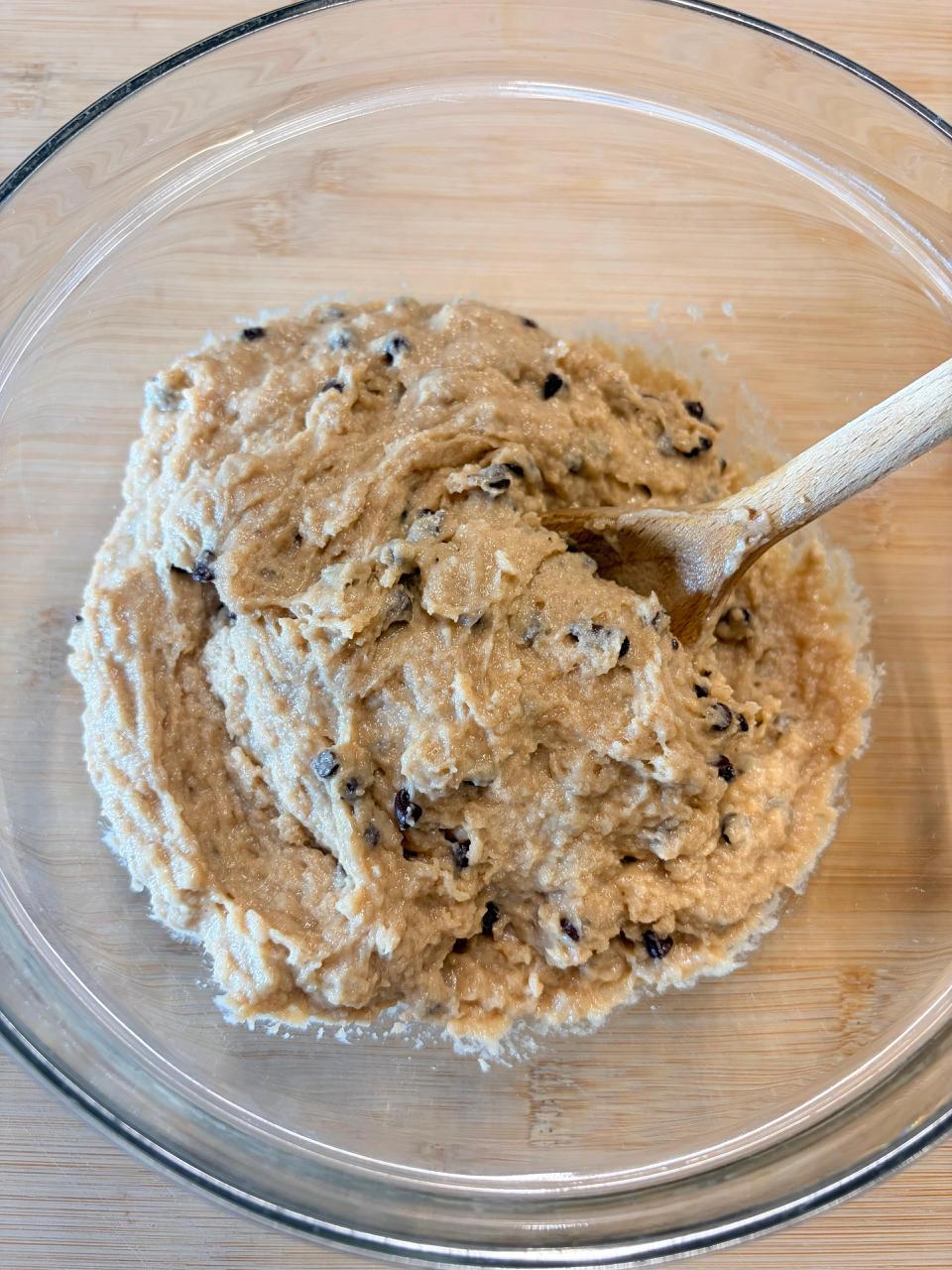 Hands mixing ingredients in a bowl